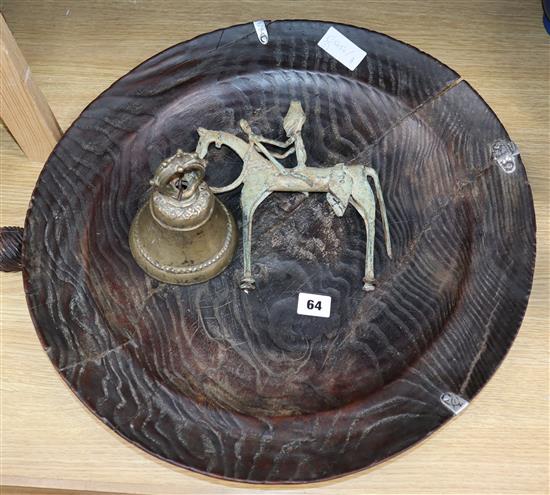 A temple bell, a bronze of a man on horseback and an elm dish diameter 48cm